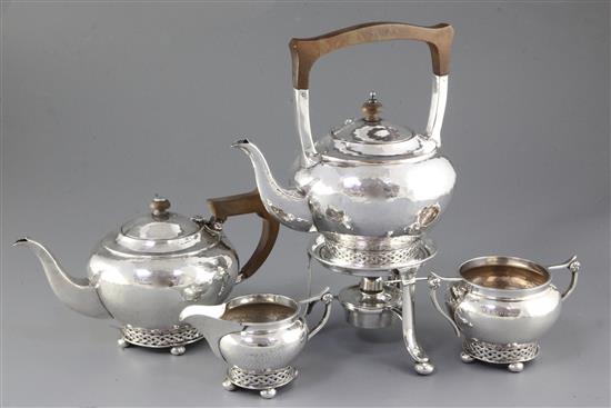 A Georged V silver Arts & Crafts three piece tea set,